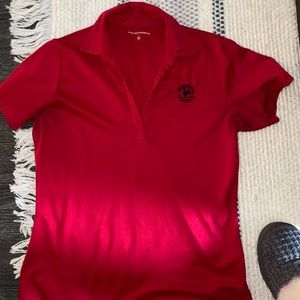 Red primrose polo with black logo